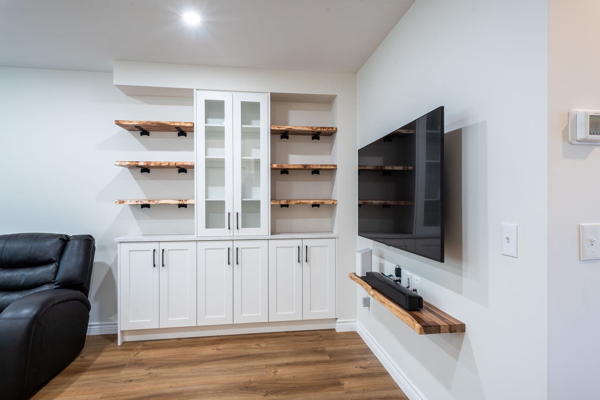 Entertainment area renovation Calgary — custom cabinets and woodwork
